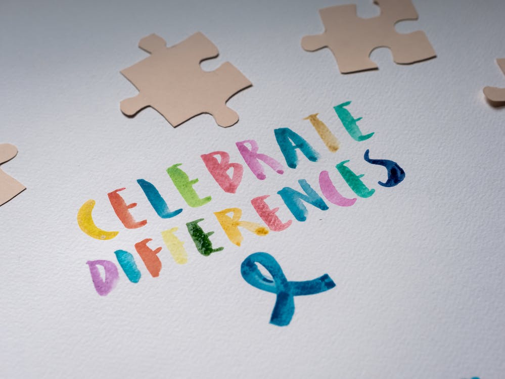 Free Celebrate Differences on White Paper Stock Photo